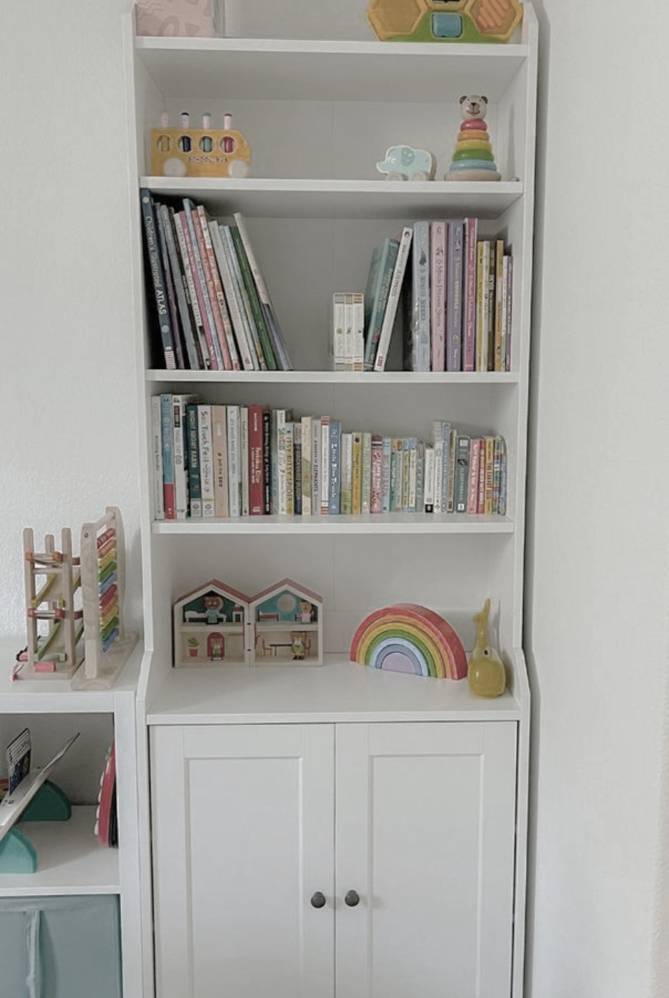 Shelving install of bookcase with toys